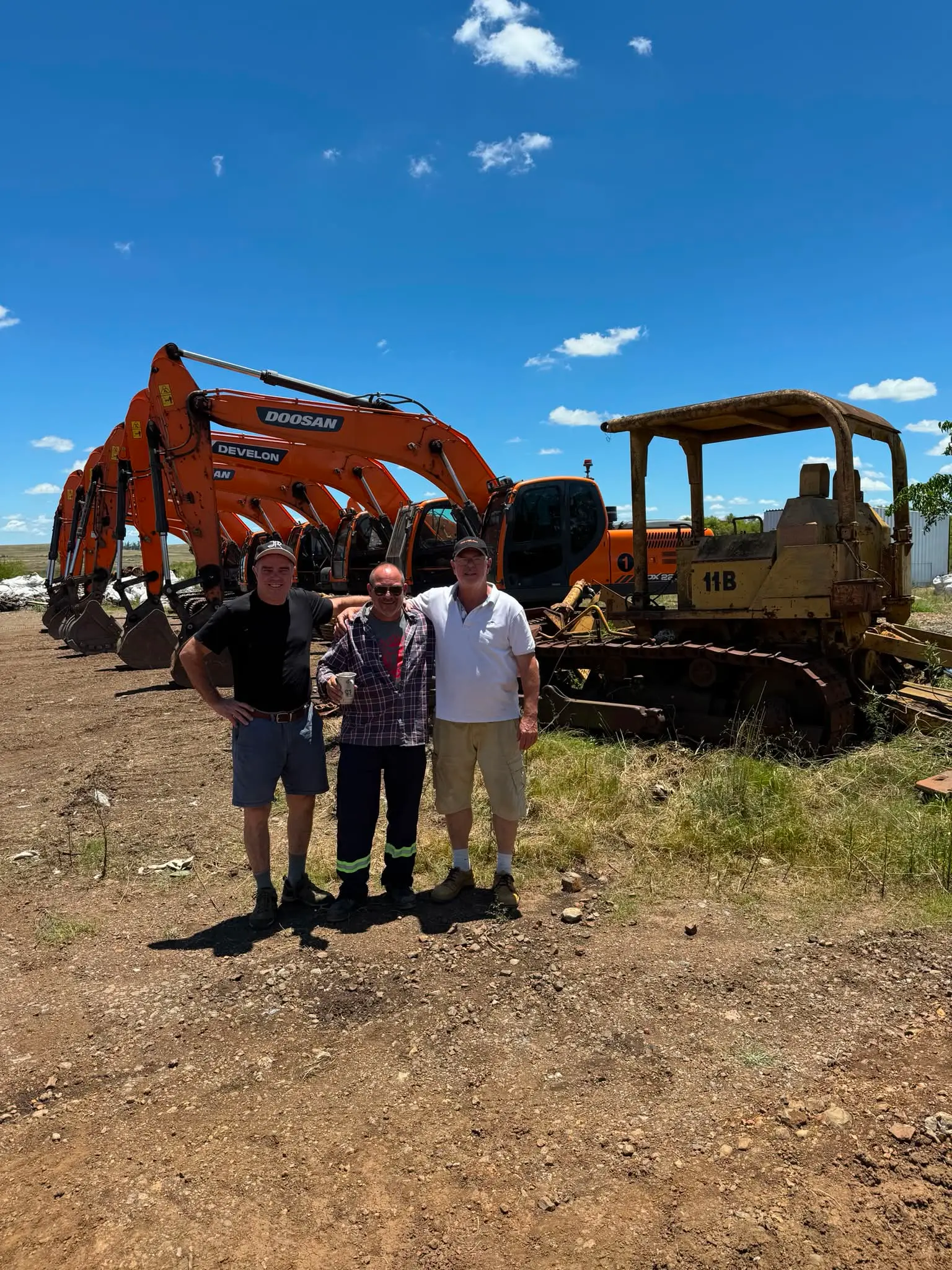 Team with mining fleet on site